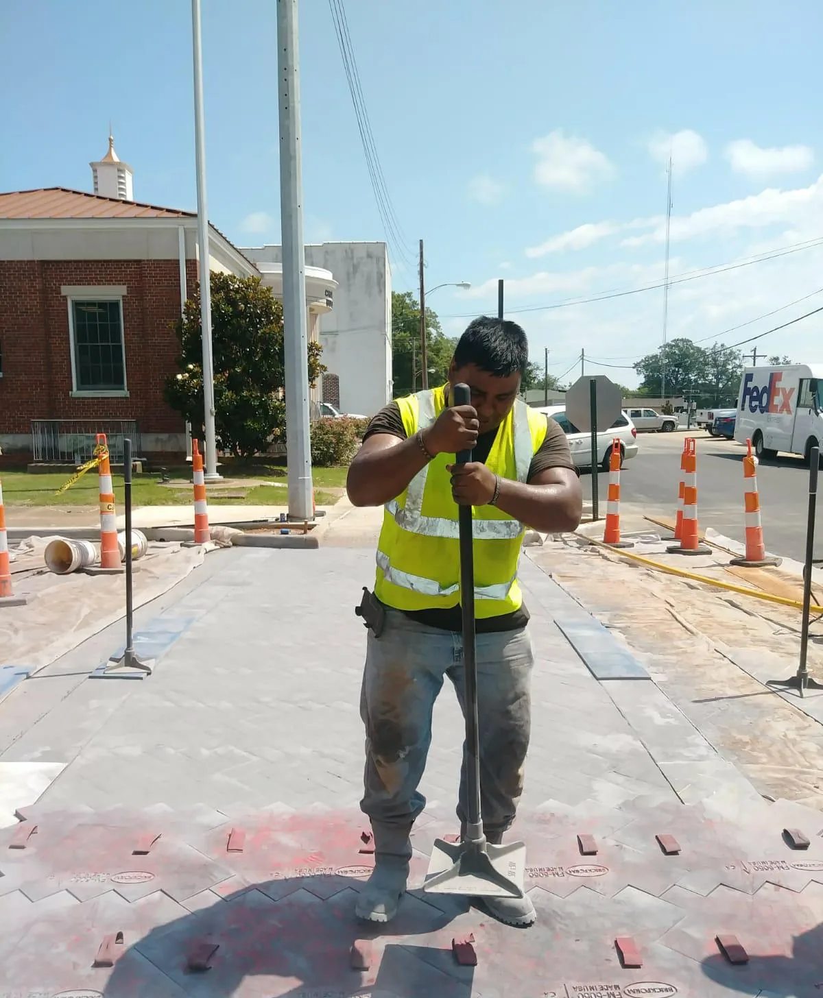 Crew stamping a commercial concrete crosswalk
