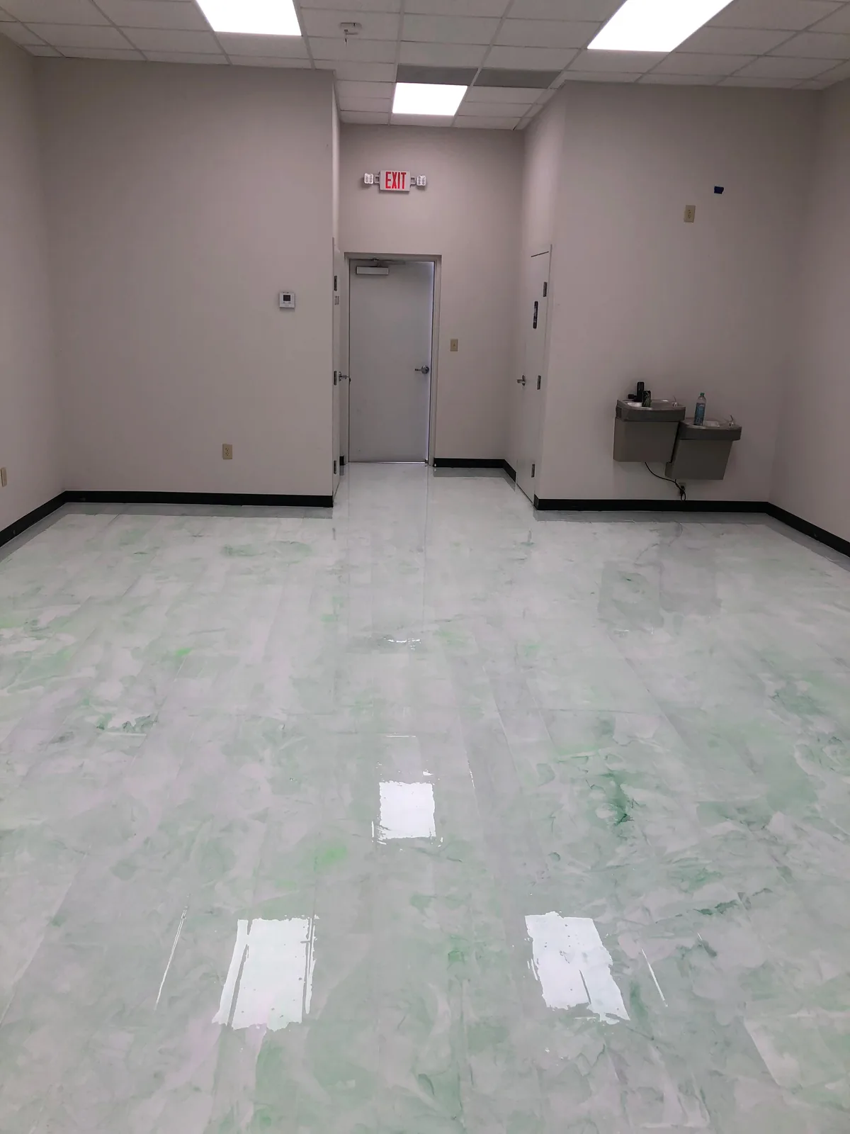 White marble-effect epoxy floor in a commercial building