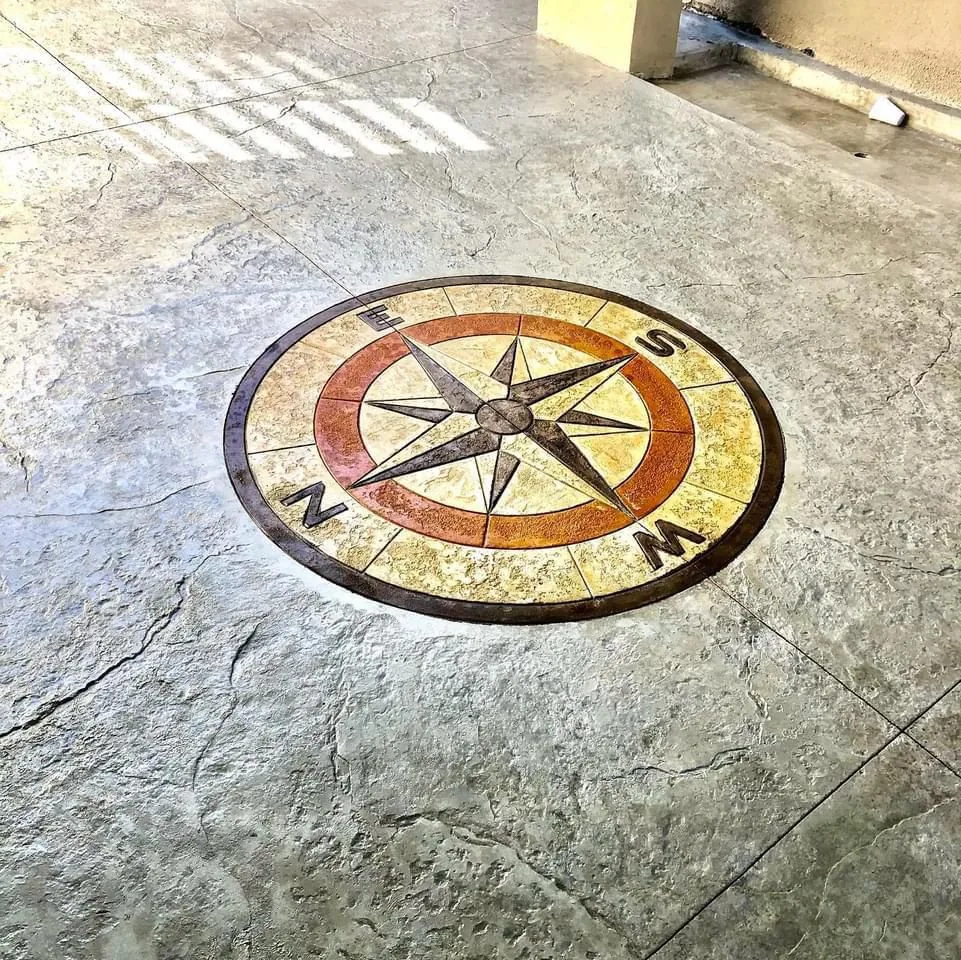 Stamped concrete patio with a custom compass rose medallion inlay